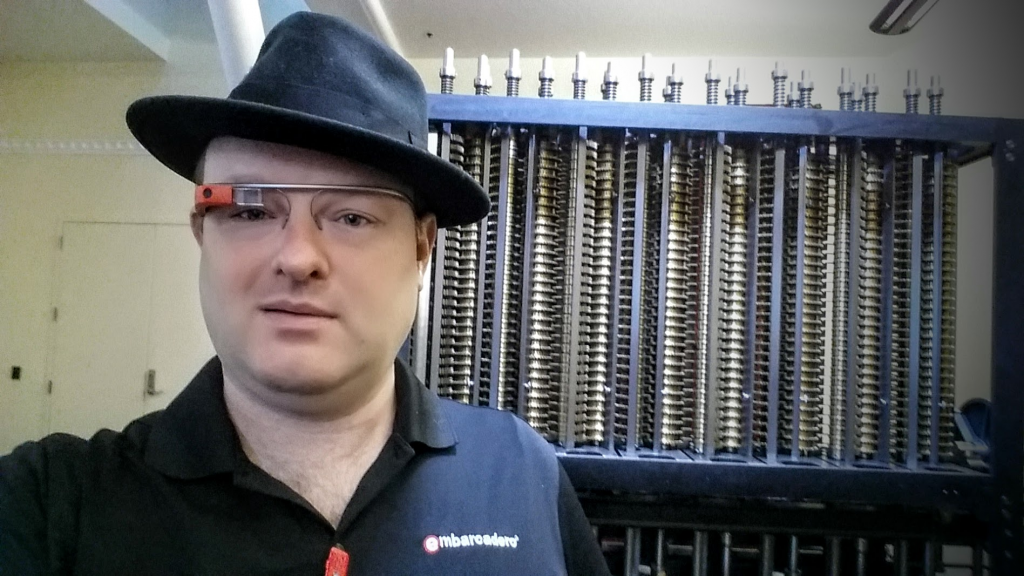 Jim McKeeth wearing his Google Glass at the Computer History Museum in Silicon Valley standing in front of the Difference Engine